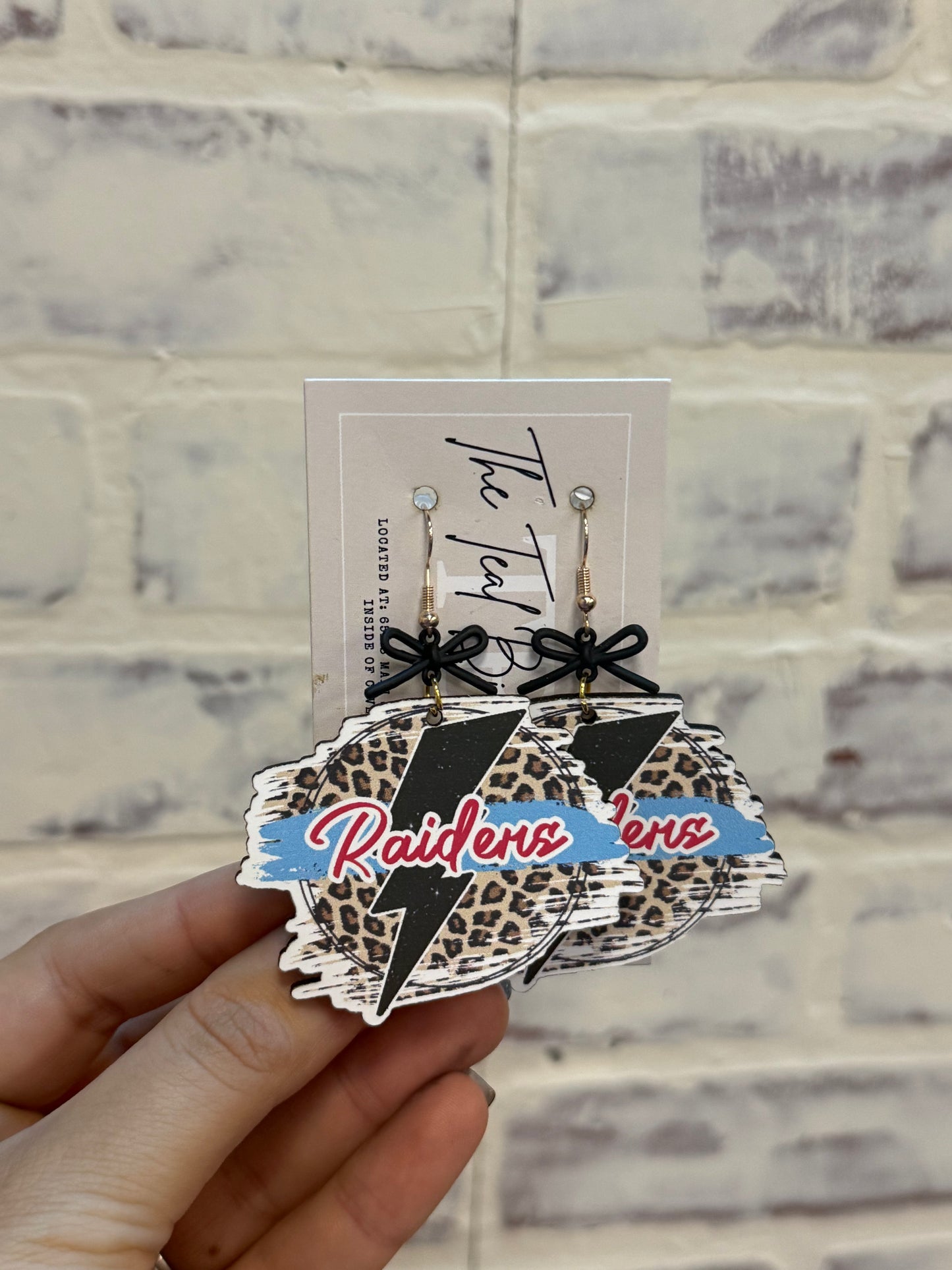 Cheeta Bow Raider Earrings